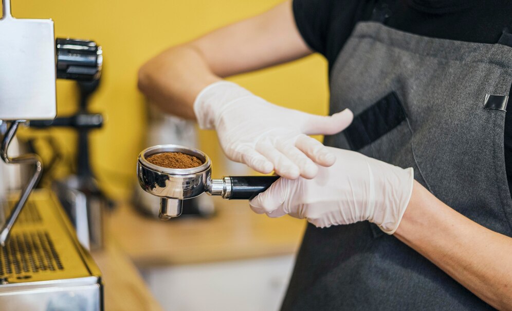 a person holding a coffee machine