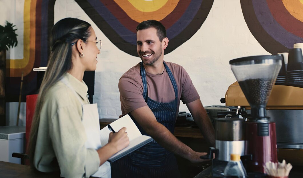 person in aprons smiling